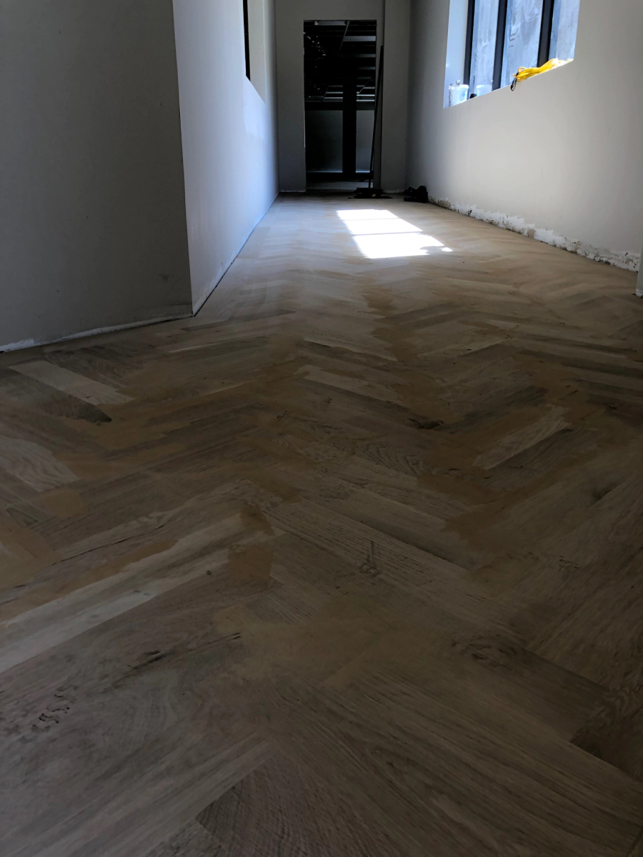 Wide plank engineered hardwood installed over a concrete slab