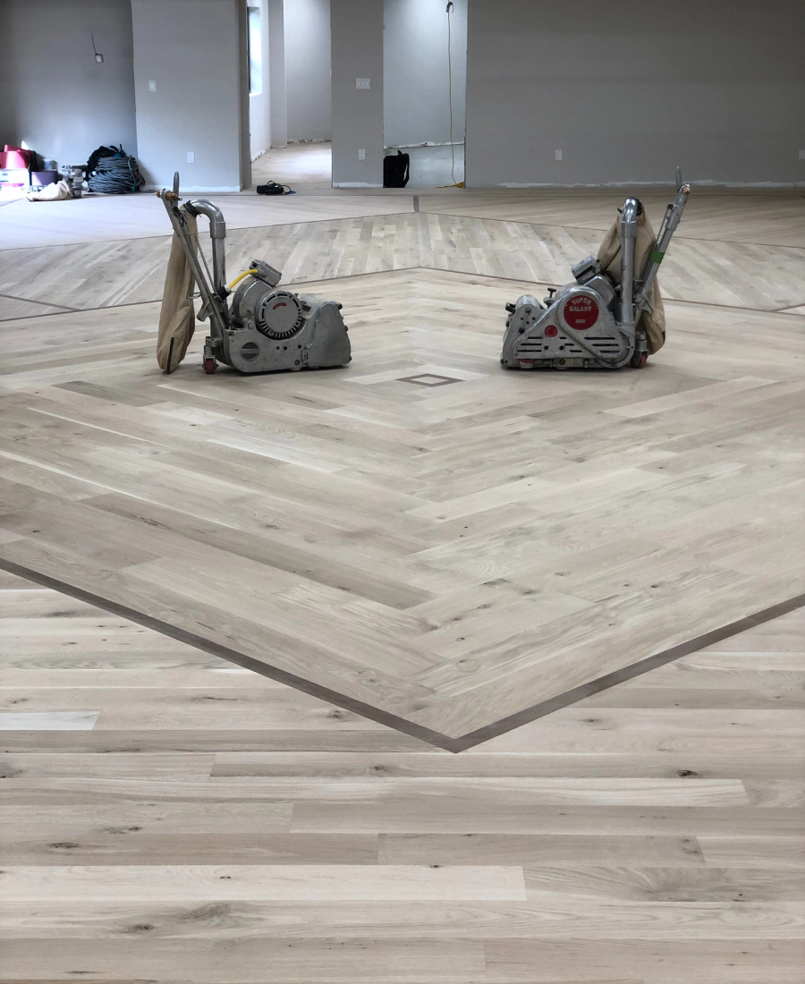 New solid oak hardwood floor being installed in an Overland Park, Kansas home